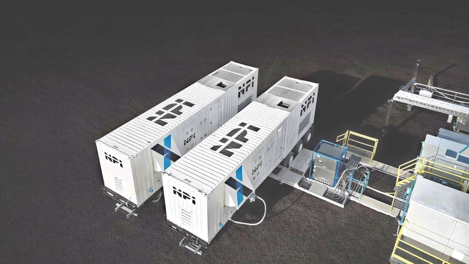 Two NexSource generator packages connected beside industrial equipment