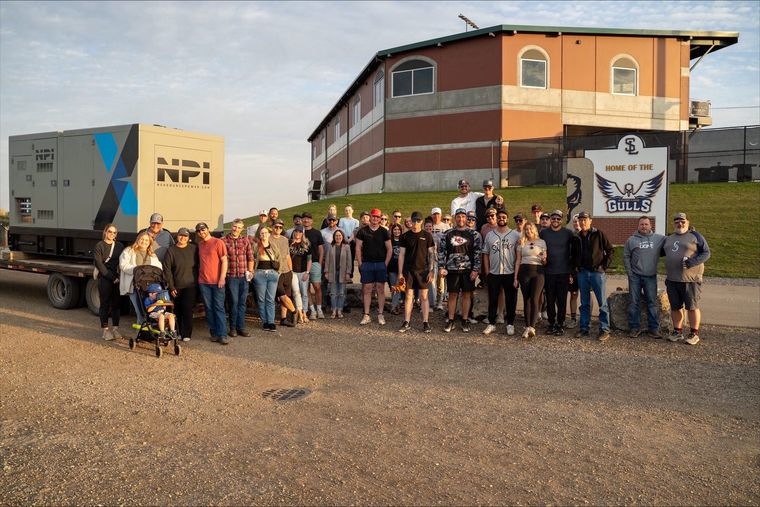 NexSource Power team and community at a ball night in Alberta